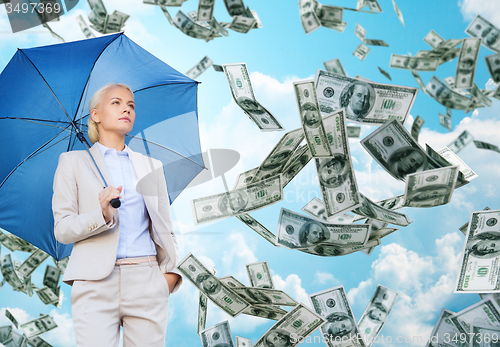 Image of young businesswoman with umbrella outdoors