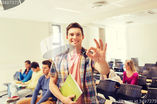 Image of group of smiling students in lecture hall