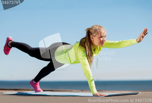 Image of woman doing sports outdoors