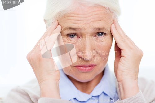 Image of face of senior woman suffering from headache