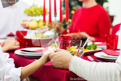 Image of close up of family having christmas dinner at home