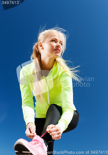 Image of woman doing sports outdoors