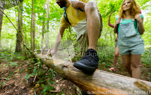 Image of close up of friends with backpacks hiking