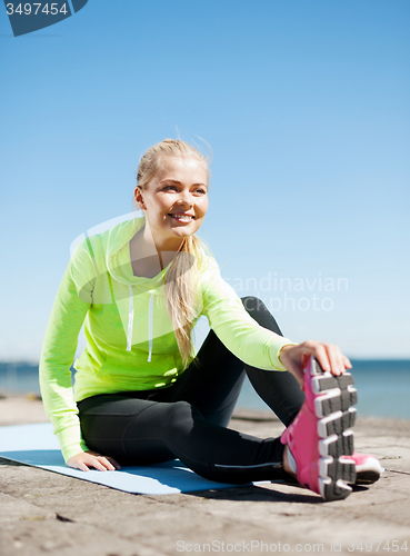 Image of woman doing sports outdoors