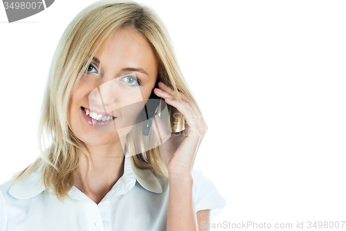 Image of Beautiful blonde girl talking on phone and smiling