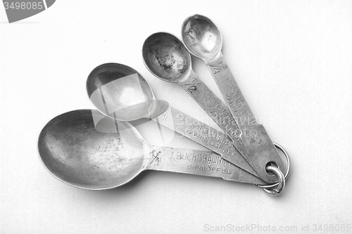 Image of old silver different spoons isolated\r\n