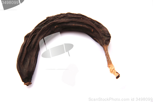 Image of old black banana isolated
