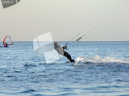 Image of Silhouette of a kite-surf on waves of a gulf 1