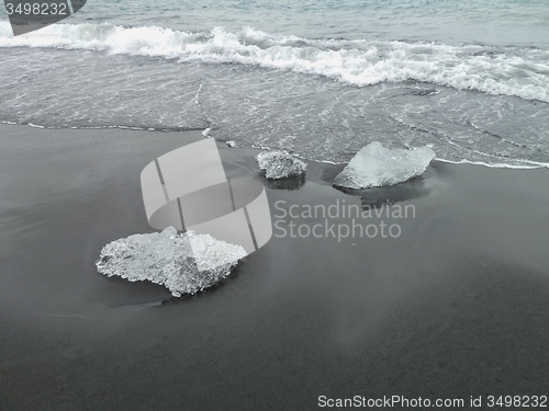 Image of beach with ice pieces