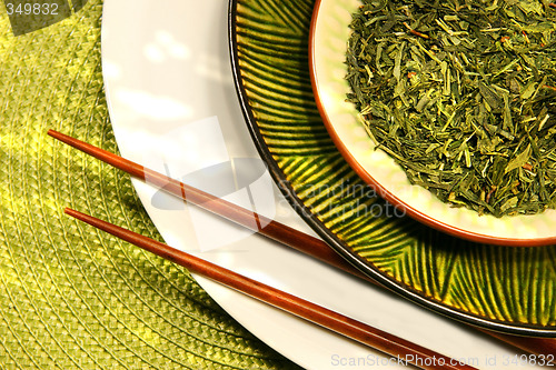 Image of Asian bowls filled with herbs