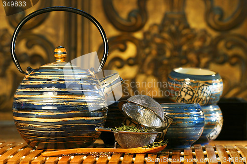 Image of Blue oriental teapot with cups