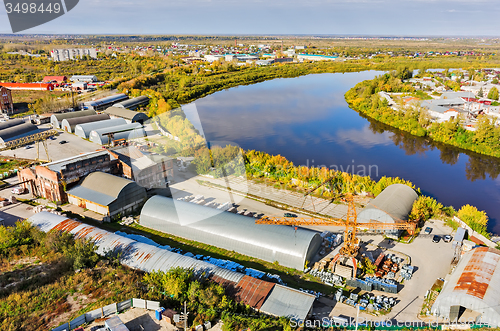 Image of Transportation company on river bank. Tyumen. Russia