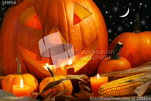 Image of Carved pumpkin with candles