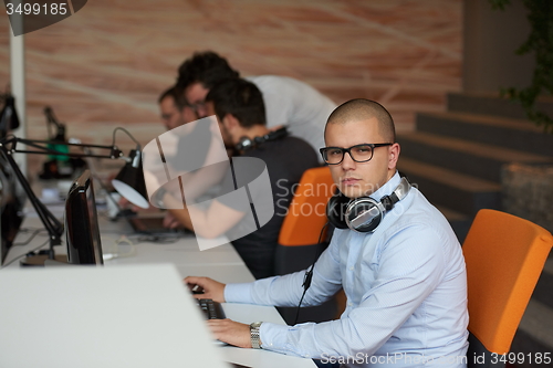 Image of startup business, software developer working on computer