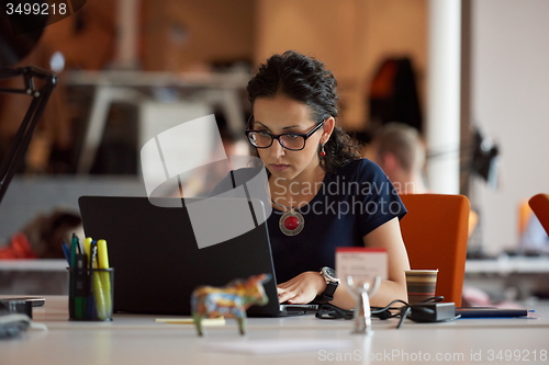 Image of startup business, woman  working on laptop