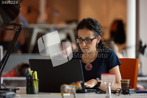 Image of startup business, woman  working on laptop