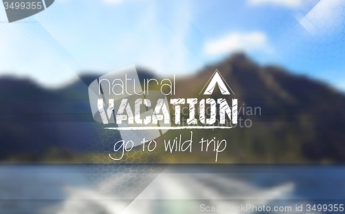 Image of Camping logo emblem on mountain blurred landscape background