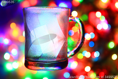 Image of glass cup on the christmas lights\r\n