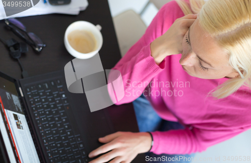 Image of Business woman working from home.