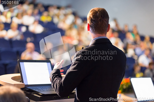 Image of Speaker at Business Conference and Presentation.