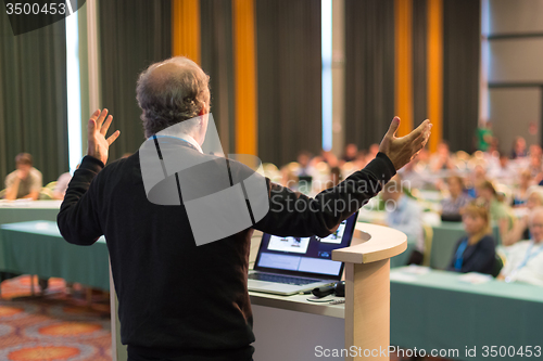 Image of Speaker at Business Conference and Presentation.