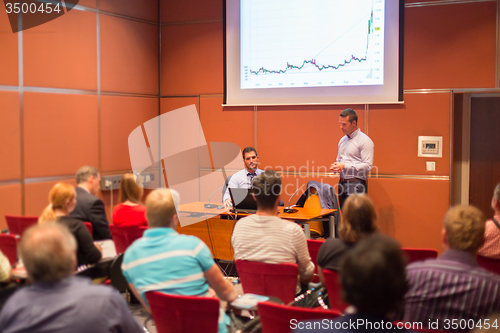 Image of Speaker at Business Conference and Presentation.