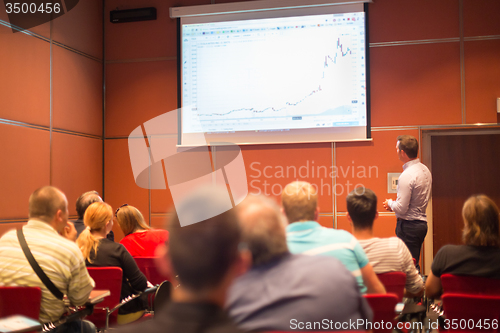 Image of Speaker Giving a Talk at Business Meeting.