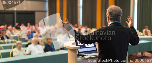 Image of Speaker at Business Conference and Presentation.