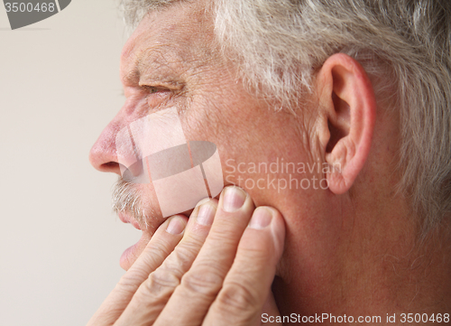 Image of man with tooth or jaw pain