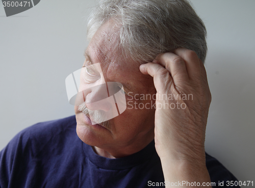 Image of man with a thoughtful look	