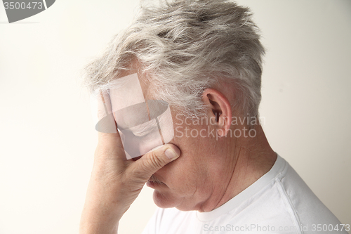 Image of older man depressed or grieving	