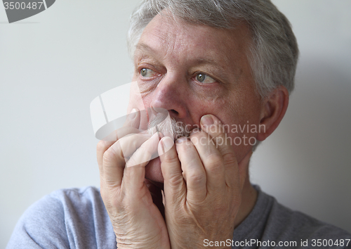 Image of very worried older man