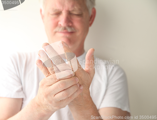 Image of senior with numb hand  