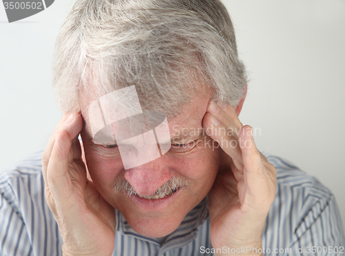 Image of man with terrible headache