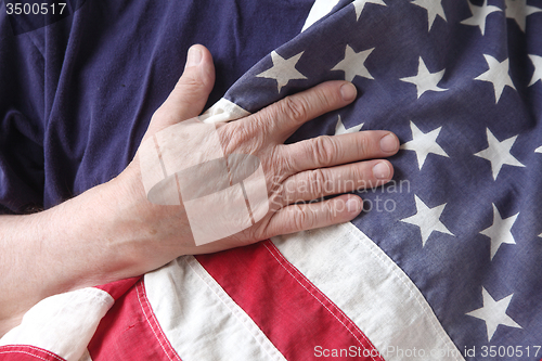 Image of USA flag held by a veteran