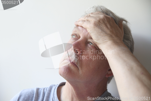 Image of senior with head pain