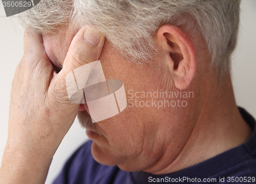 Image of older man depressed or grieving	