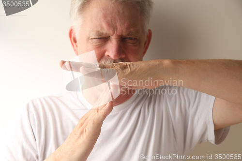 Image of man uses timeout hand signal  