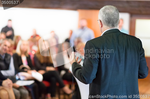 Image of Speaker at Business Conference and Presentation.