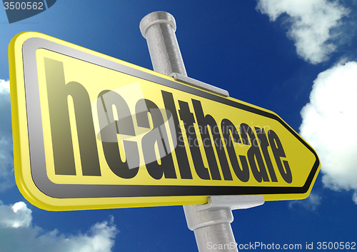 Image of Yellow road sign with healthcare word under blue sky