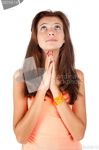 Image of Pretty girl praying and looking upward