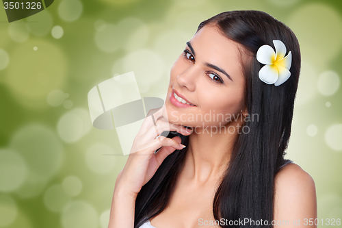 Image of Teen female with Plumeria Flower