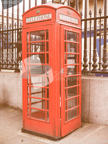 Image of Retro looking Red phone box in London