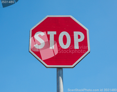 Image of Stop sign over blue sky