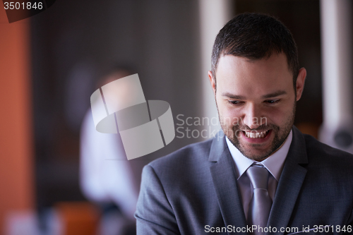 Image of young business man portrait  at modern office