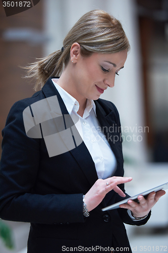 Image of business woman working on tablet