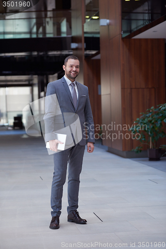 Image of business man with tablet