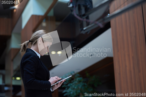 Image of business woman working on tablet