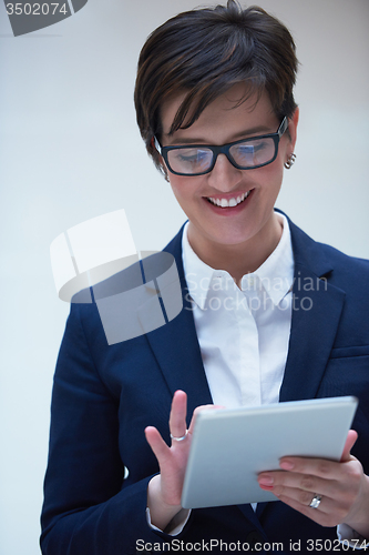 Image of business woman working on tablet