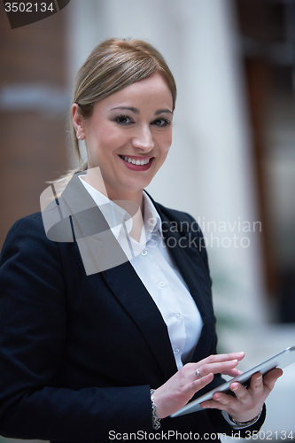 Image of business woman working on tablet
